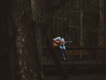 Man playing guitar outdoors