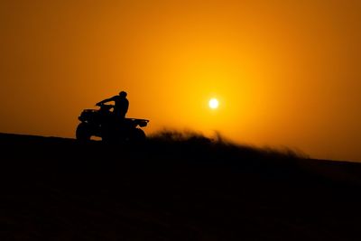 Silhouette people at sunset