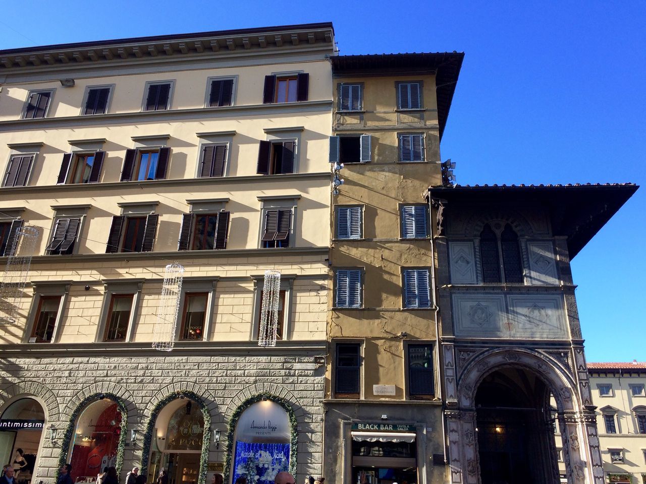 building exterior, architecture, built structure, low angle view, outdoors, sky, city, facade, no people, balcony, day