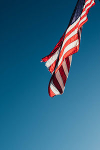 American united state usa flag waving in the blue sky