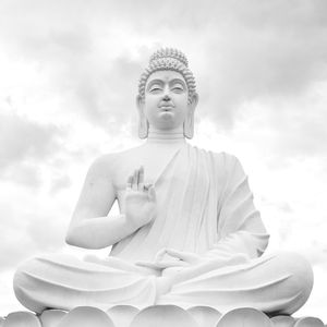 Low angle view of statue against sky