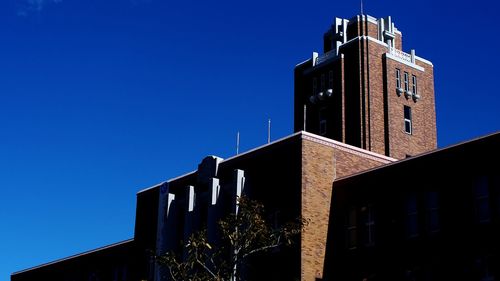 Low angle view of building against blue sky