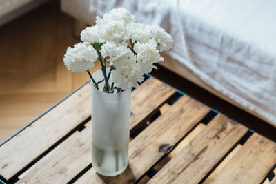 Close-up of white flower vase on table