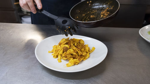 Plate of homemade tagliatelle with ragù. italian food. restaurant.