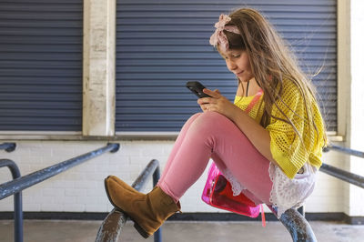 Young woman using mobile phone