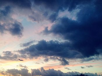 Low angle view of dramatic sky during sunset