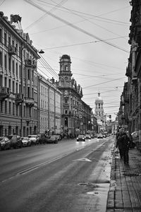 City street and buildings against sky