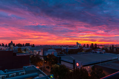 High angle view of buildings against sky during sunset