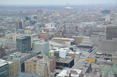 High angle view of modern buildings in city against sky