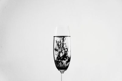 Close-up of wine against white background