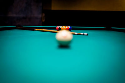 Cropped hand playing pool