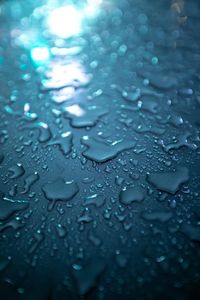 Full frame shot of raindrops on glass