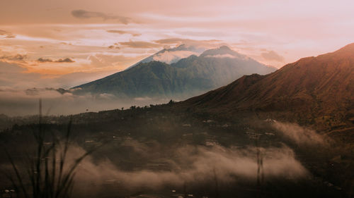 Scenic view of mountains against sky during sunset