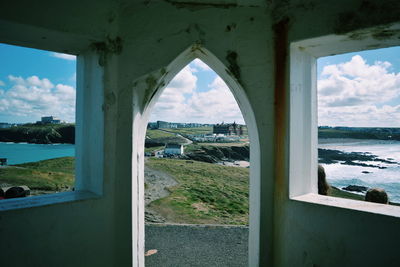 View of built structures against cloudy sky