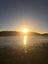 Scenic view of sunset over river