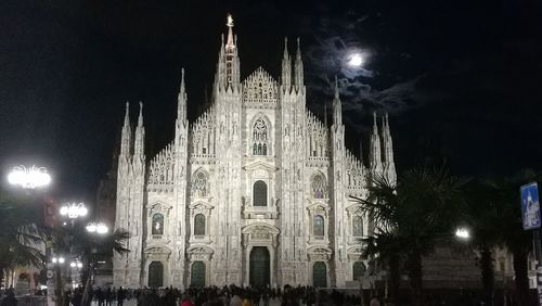 Panoramic view of illuminated building at night