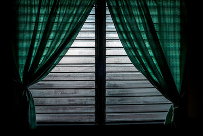 Green curtains on window