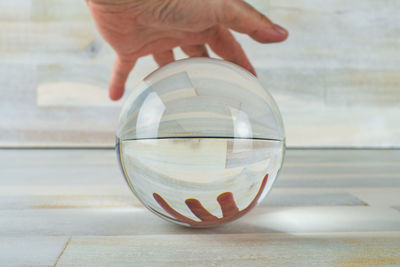 Close-up of person holding crystal ball