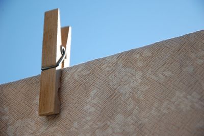 Low angle view of cross against clear blue sky
