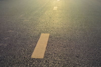 Close-up of arrow symbol on road