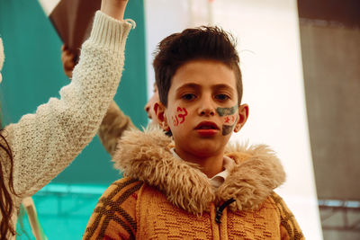 Portrait of boy with face paint