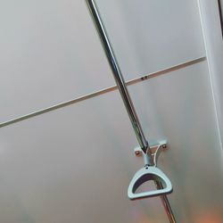 Low angle view of handle in bus