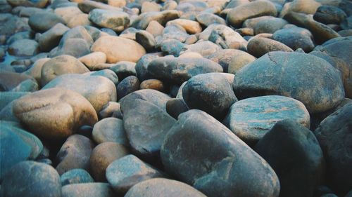 Full frame of pebbles on shore