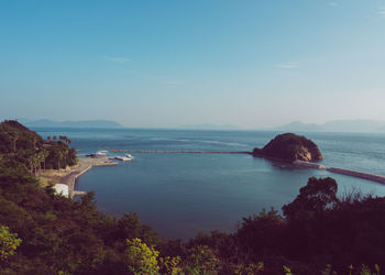 Scenic view of sea against blue sky