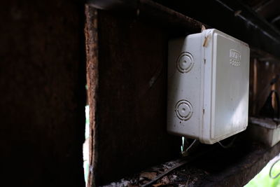 Close-up of old fuse box on wall