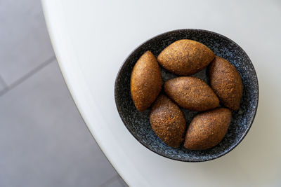 Stuffed meatballs called kibbeh  or  köfte popular dish in middle easte