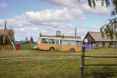 House on field against sky