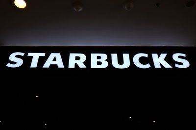 Low angle view of illuminated text on ceiling
