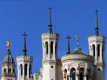 Low angle view of building against blue sky