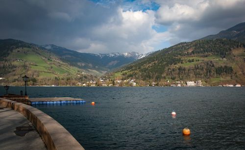 Scenic view of lake and mountains against sky