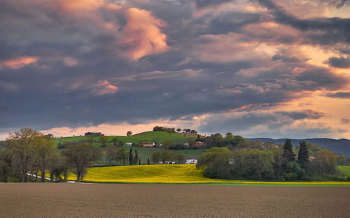 Scenic view of landscape against sky during sunset