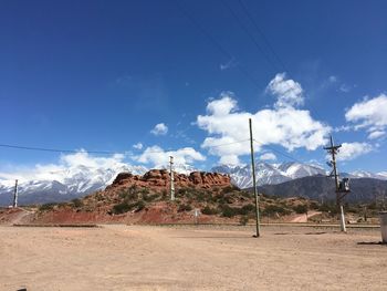 Scenic view of landscape against blue sky