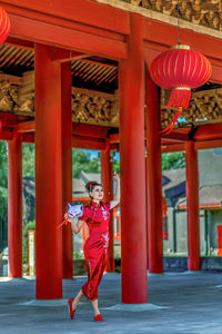 Rear view of girl standing in city