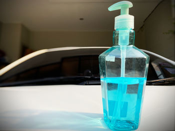 Close-up of glass bottle on table