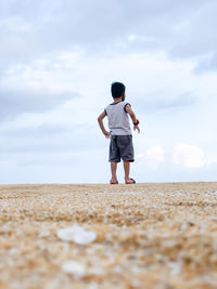 Full length of woman standing on beach