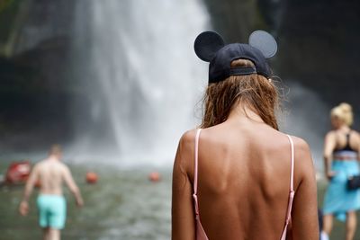 Rear view of woman wearing hat outdoors