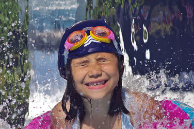 Portrait of young woman in water