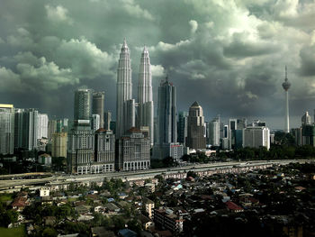 Modern buildings in city against sky