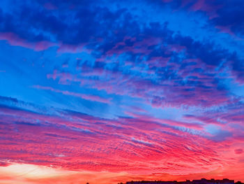 Low angle view of dramatic sky during sunset