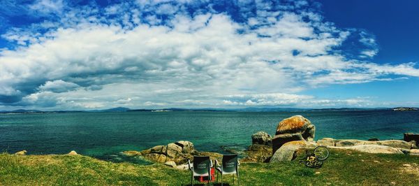 Rear view of panoramic shot of sea against sky