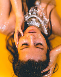 Close-up portrait of young woman in water