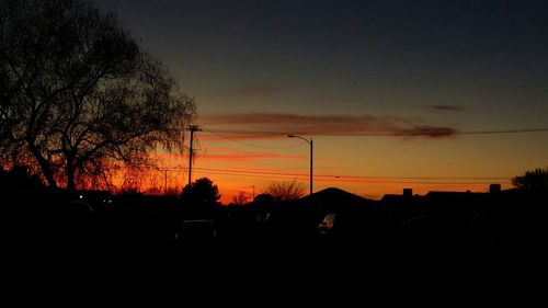 Silhouette of built structure at sunset