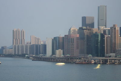 Modern buildings in city against clear sky