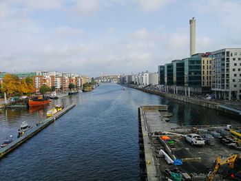Panoramic view of river and city against sky