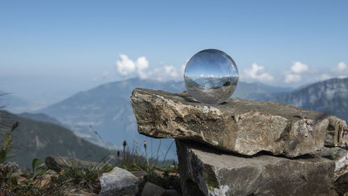 Scenic view of rocks and mountains against sky