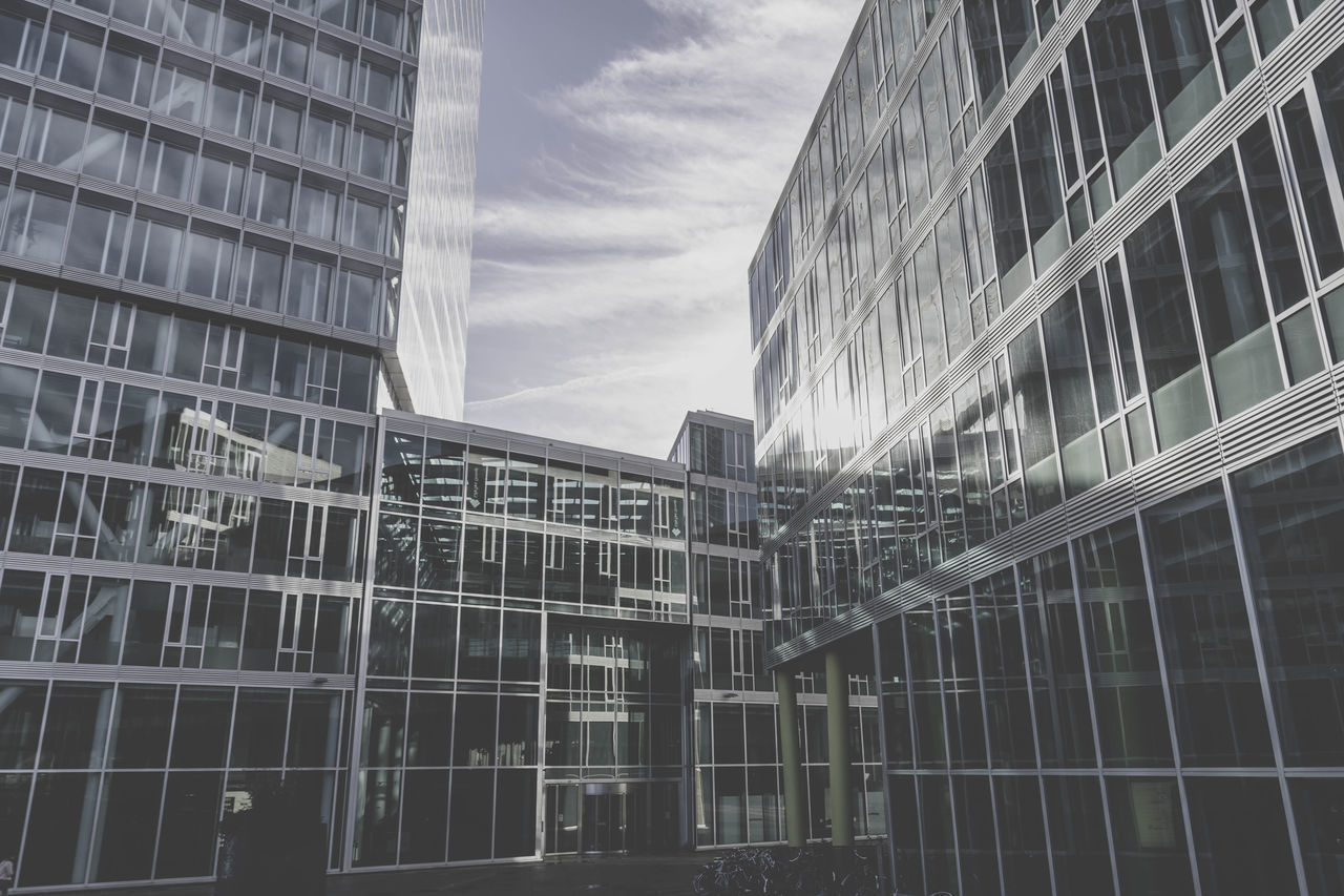 LOW ANGLE VIEW OF MODERN BUILDINGS AGAINST SKY